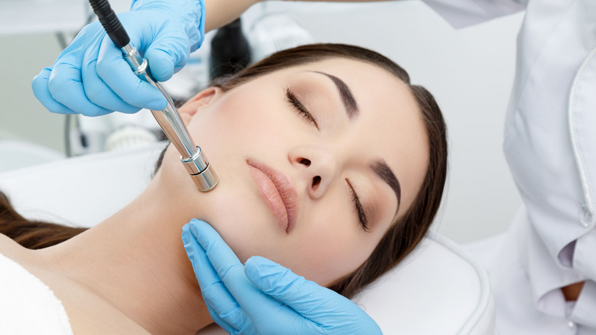 Professional facial treatment being performed with advanced equipment during microdermabrasion in tysons corner va